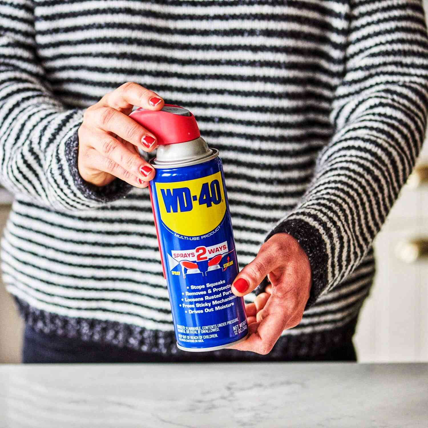 Woman Holds WD-40