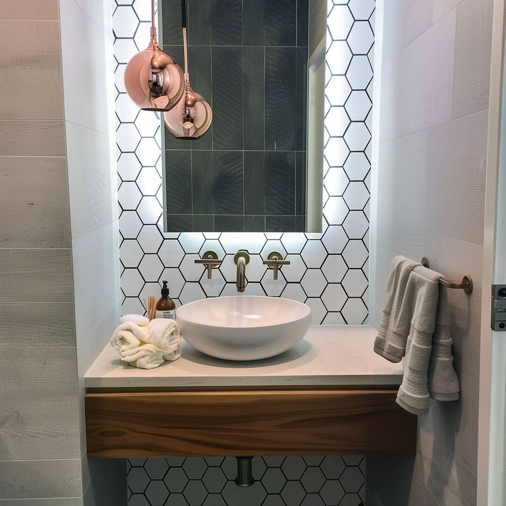 Compact Powder Room With Honeycomb Pattern Accent Wall