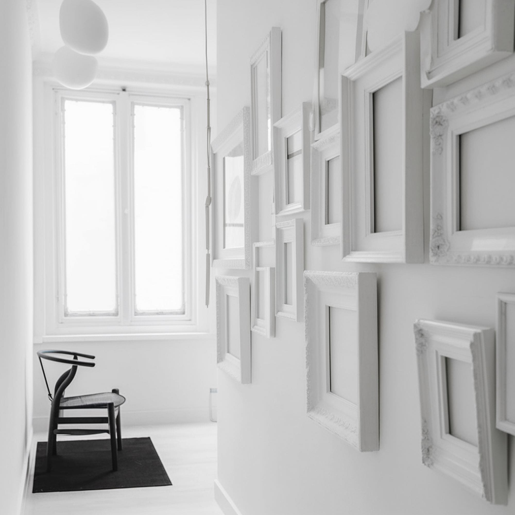 White Empty Frames in the Hallway