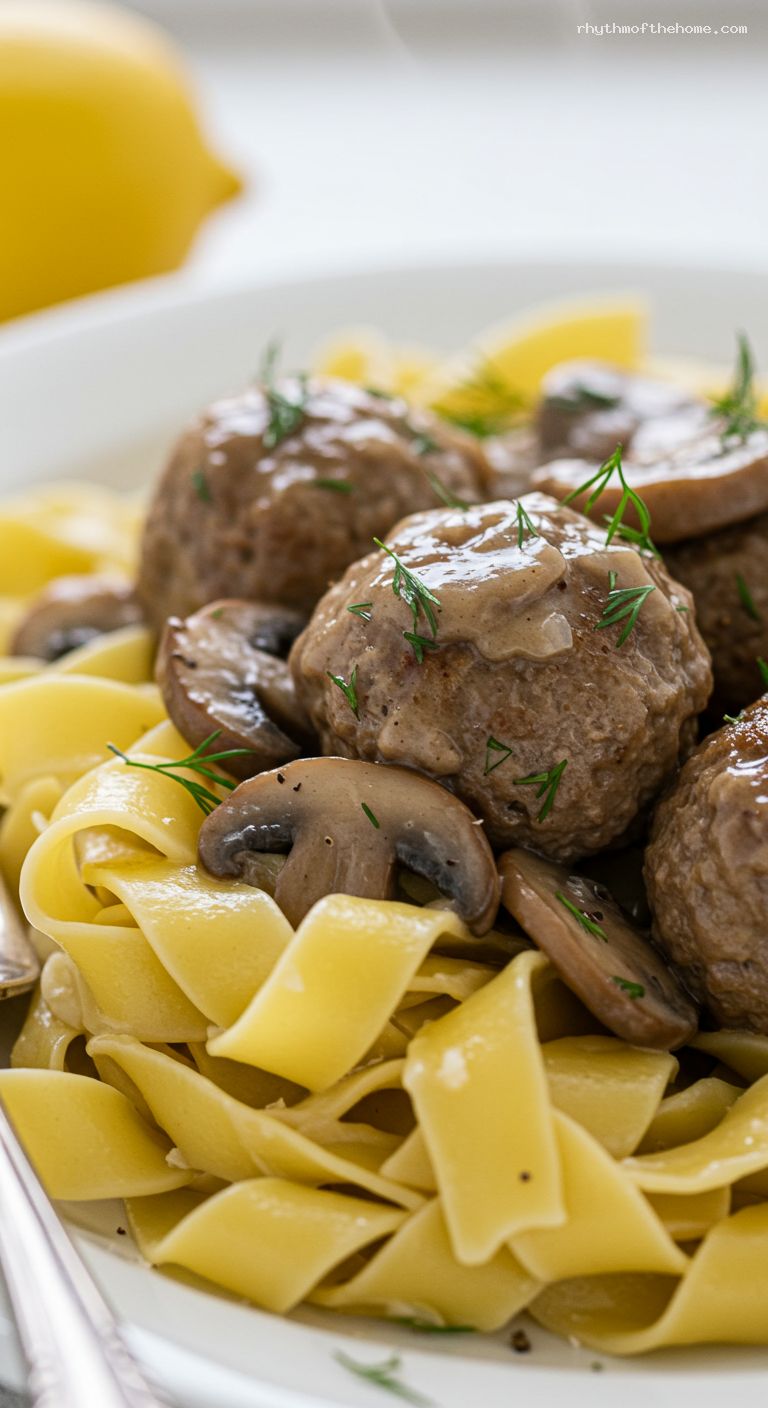 Creamy Beef Stroganoff Meatballs with Buttered Noodles – Closeup