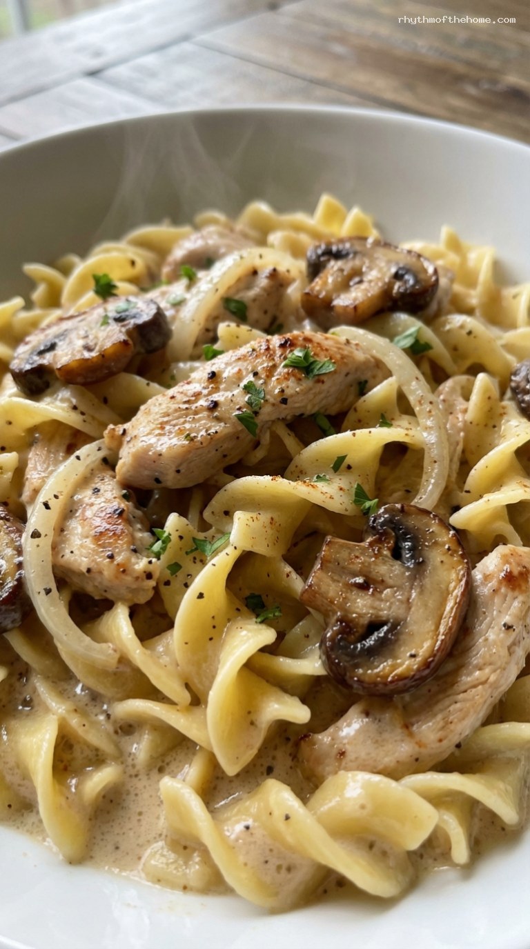 Creamy Chicken Stroganoff with Mushrooms over Egg Noodles – Closeup